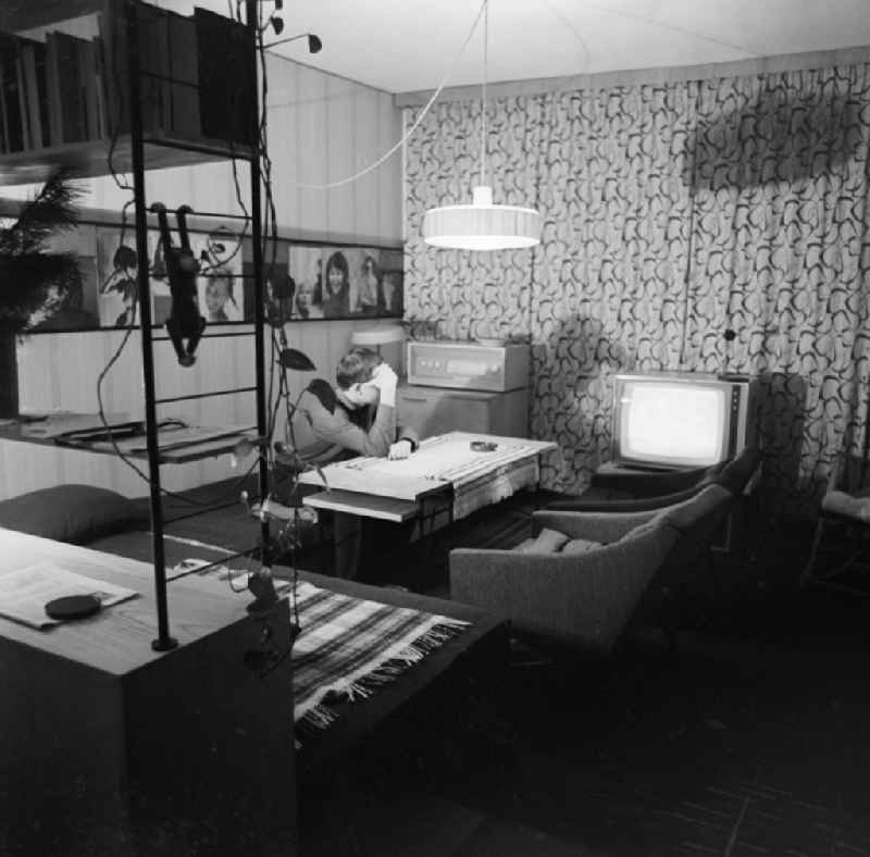 Young man in a living room with modern amenities in Berlin