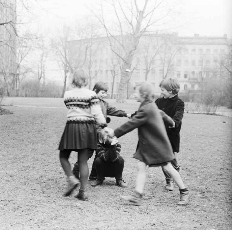 Children playing at a dance game outdoors in Berlin