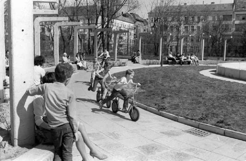 Children ride scooters in the Ernst Thalmann Park in Berlin. The Ernst Thalmann park was created in the 198