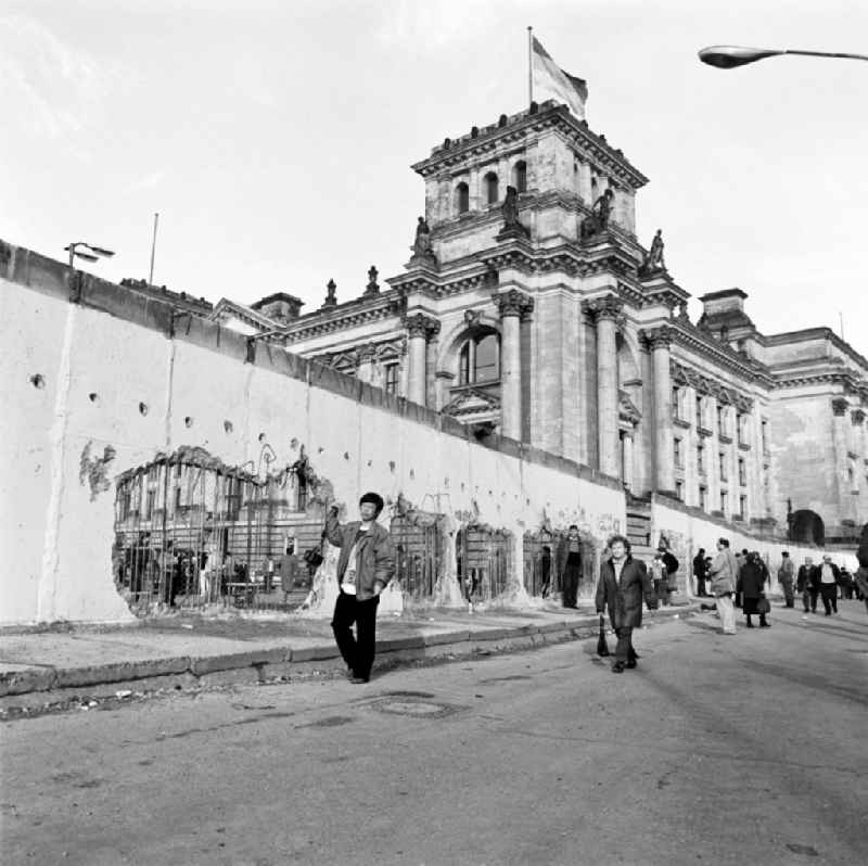 Dismantling of the Berlin Wall at the Reichstag building in Berlin