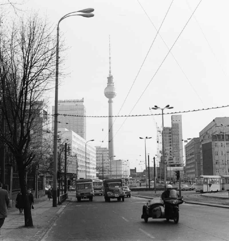 View from the Prenzlauer Allee on the Karl-Liebknecht-Strasse towards Alexanderplatz in Berlin. In the background of the Berlin TV Tower, the 'Hotel Stadt Berlin' and the Centrum department store at Alexanderplatz