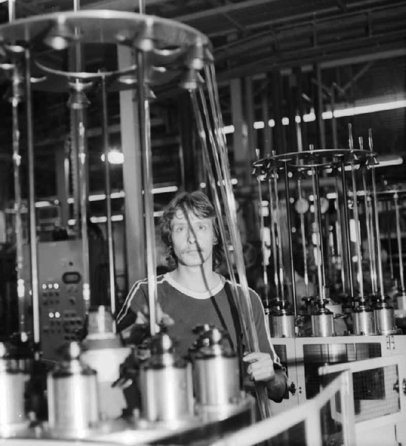 An employee in production in Kombinat VEB Narva Berliner incandescent lamp factory in Berlin, the former capital of the GDR, the German Democratic Republic