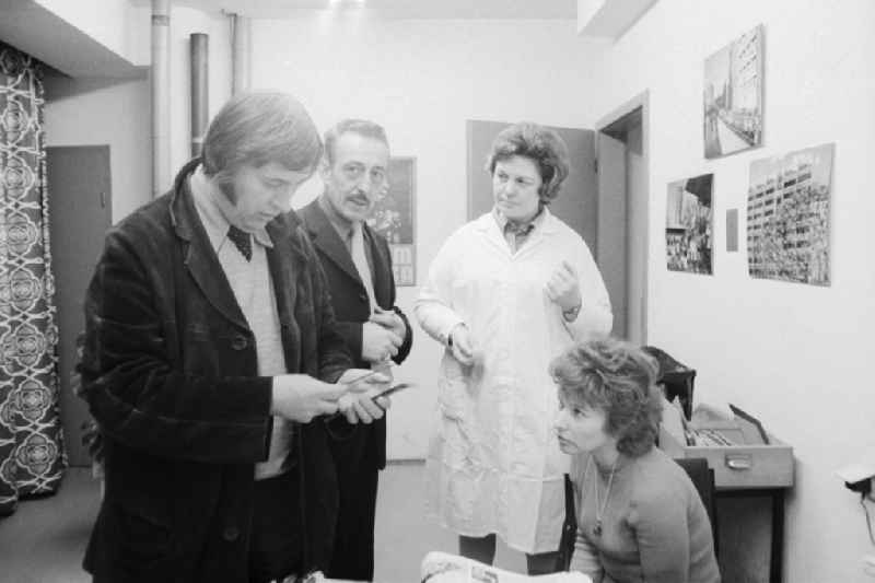 Employees in the photo lab of the daily newspaper ND - New Germany - in Berlin, the former capital of the GDR, the German Democratic Republic. From left: the photographer Siegfried Bonitz and Heinz Schonfeld beside the photo-lab technician Barbara Rucht