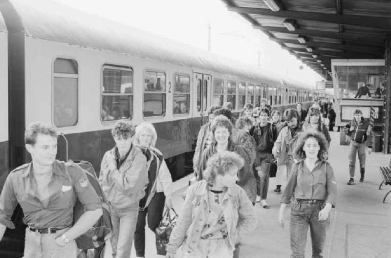 Arrival of participants to the Pentecost meeting of youth at the Lichtenberg station in Berlin, the former capital of the GDR, the German Democratic Republic