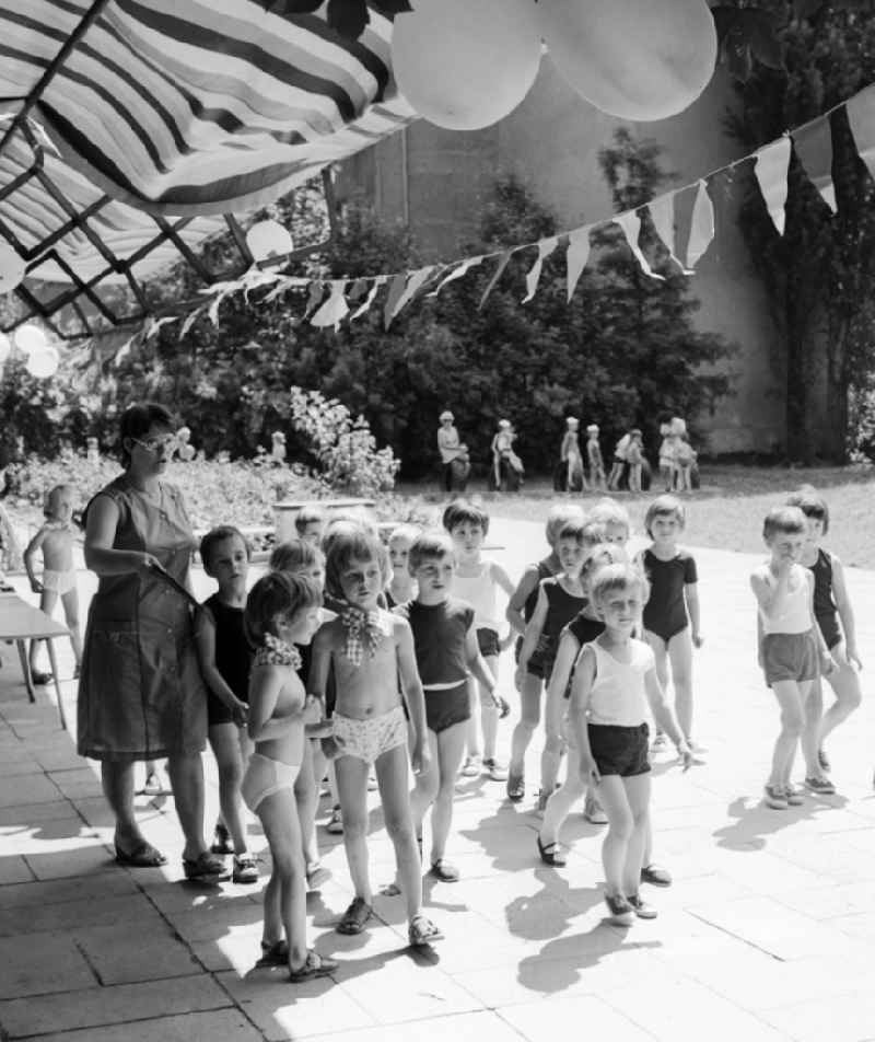 Children celebrate the International Children's Day in a kindergarten in Berlin, the former capital of the GDR, German Democratic Republic