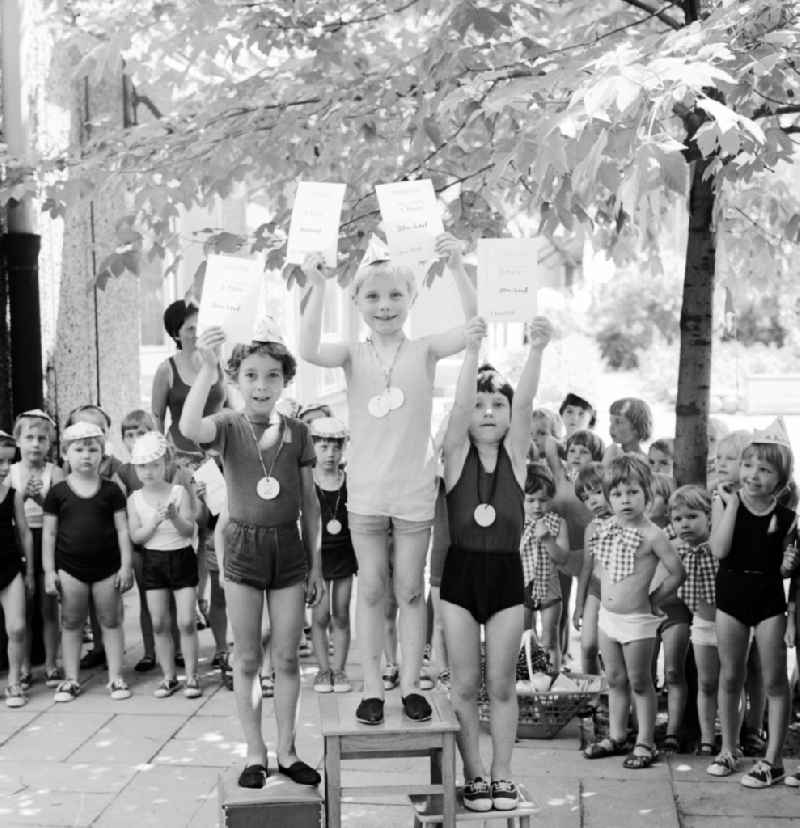 Children celebrate the International Children's Day at a preschool in Berlin, the former capital of the GDR, German Democratic Republic. On this day there was always a festive program which consisted of sport and play. Here is a presentation ceremony