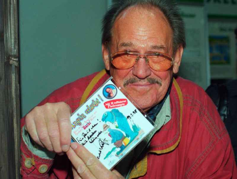 The actor, voice actor and presenter Herbert Koefer, with his radio play CD 'fishing allowed' in Berlin, the former capital of the GDR, German Democratic Republic