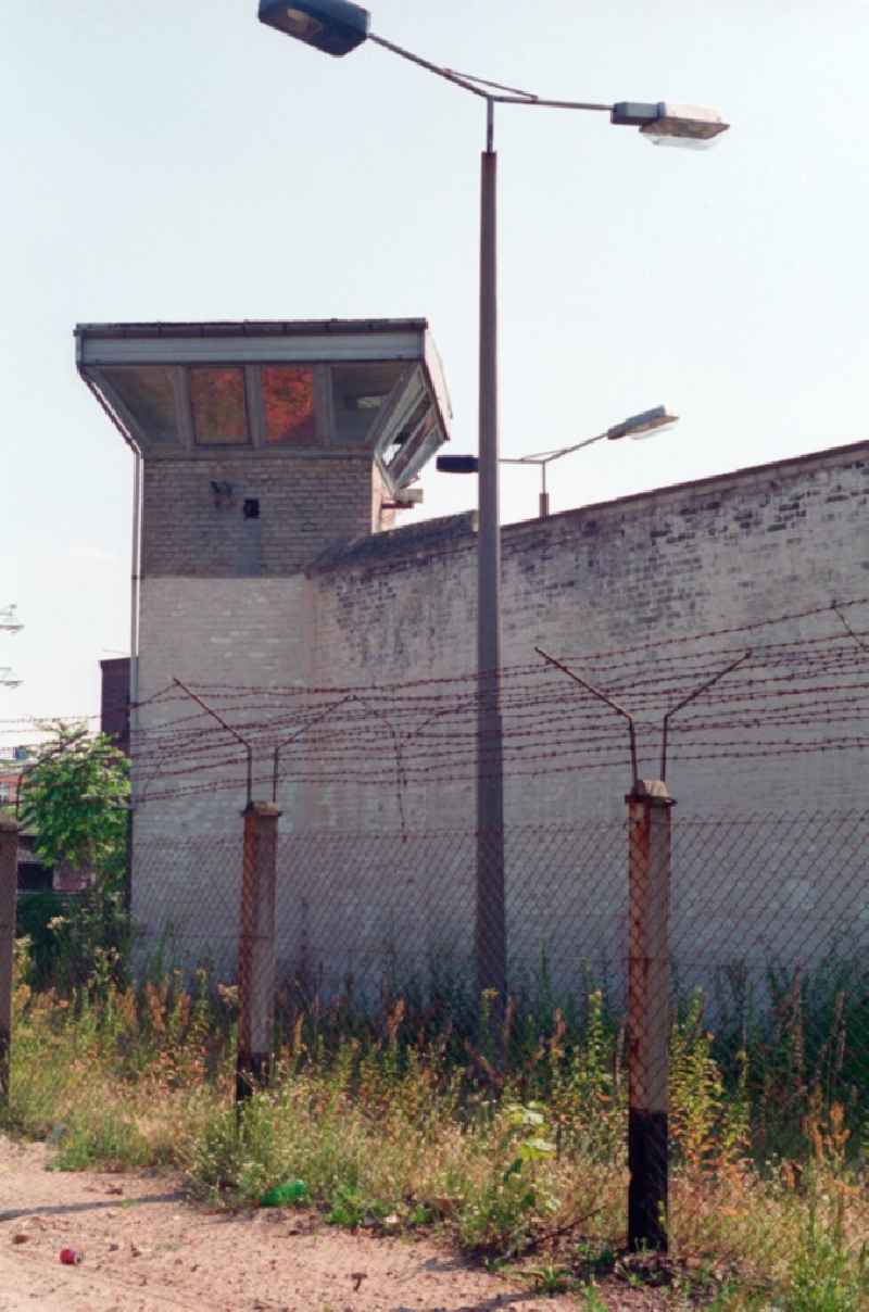 Watchtower with barbed wire at the site of the former prison Rummelsburg in Berlin, the former capital of the GDR, German Democratic Republic. The facility was used as a detention facility in the police. It offered space for up to 90