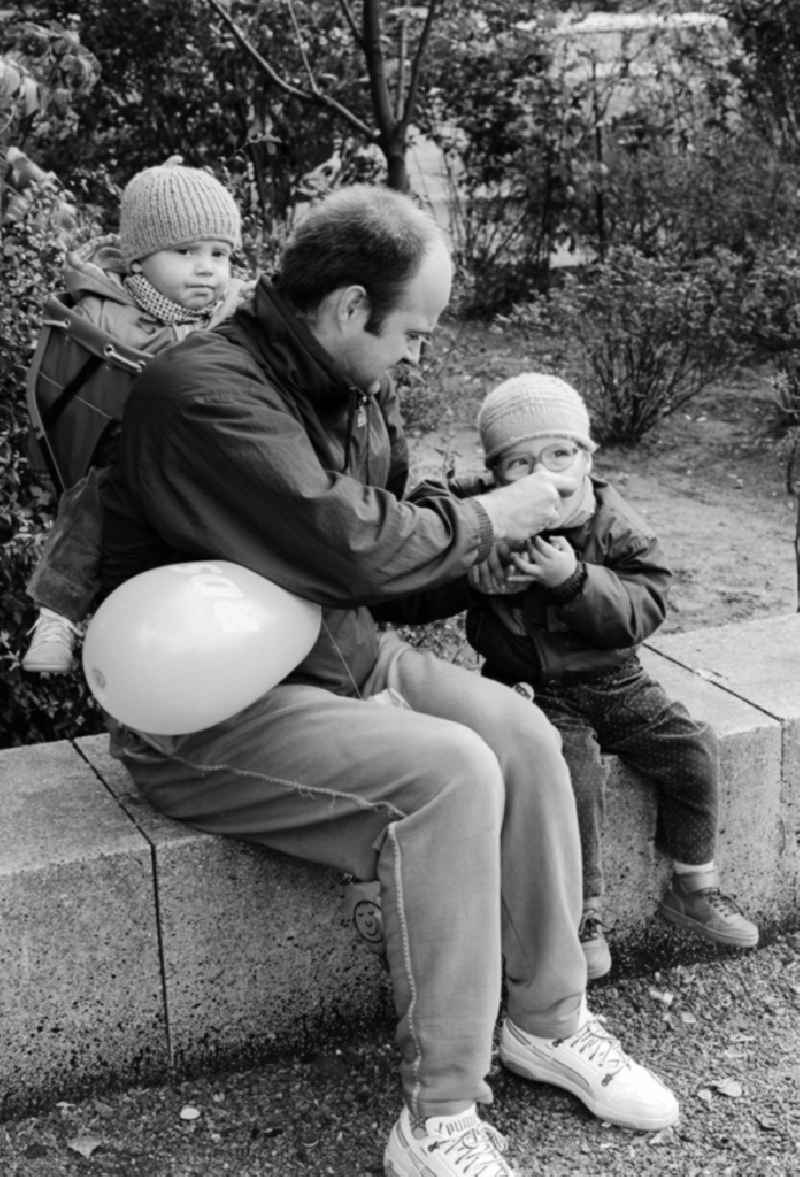 Father with two children in Berlin, the former capital of the GDR, German Democratic Republic