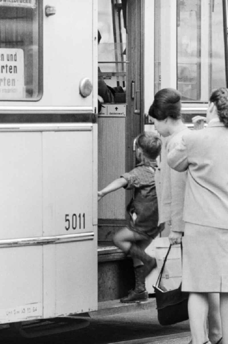 A Little Boy rises in a tram in Berlin, the former capital of the GDR, German Democratic Republic