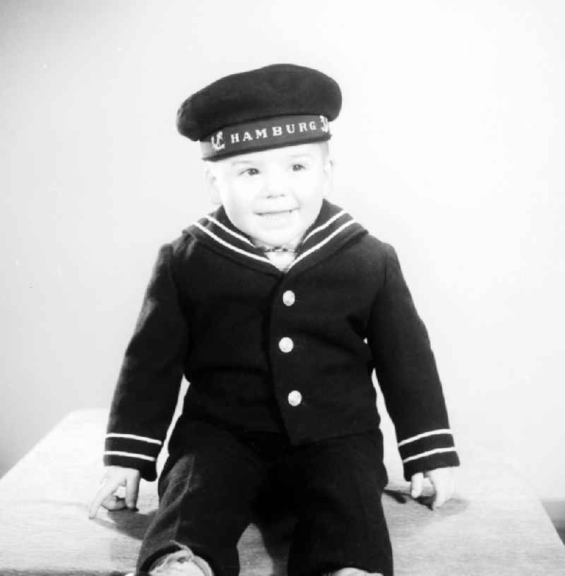Little boy in sailor uniform in Berlin, the former capital of the GDR, German Democratic Republic