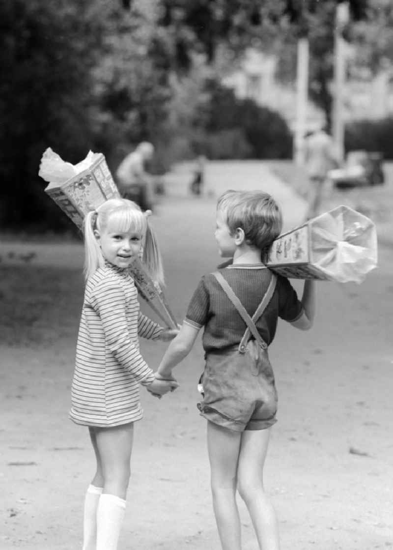 Two first graders with their bags of sugar in Berlin, the former capital of the GDR, German Democratic Republic