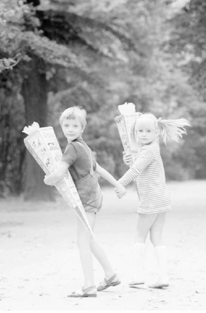 Two first graders with their bags of sugar in Berlin, the former capital of the GDR, German Democratic Republic