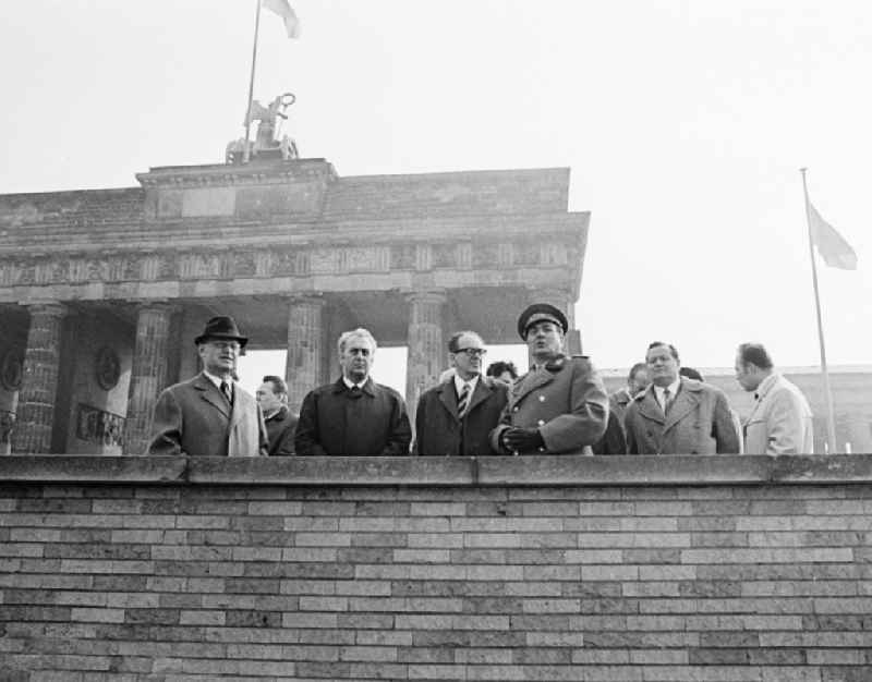 The commander of the Soviet sector of Berlin, general Artur Kunath, with politicians at the Brandenburg Gate in Berlin, the former capital of the GDR, German democratic republic