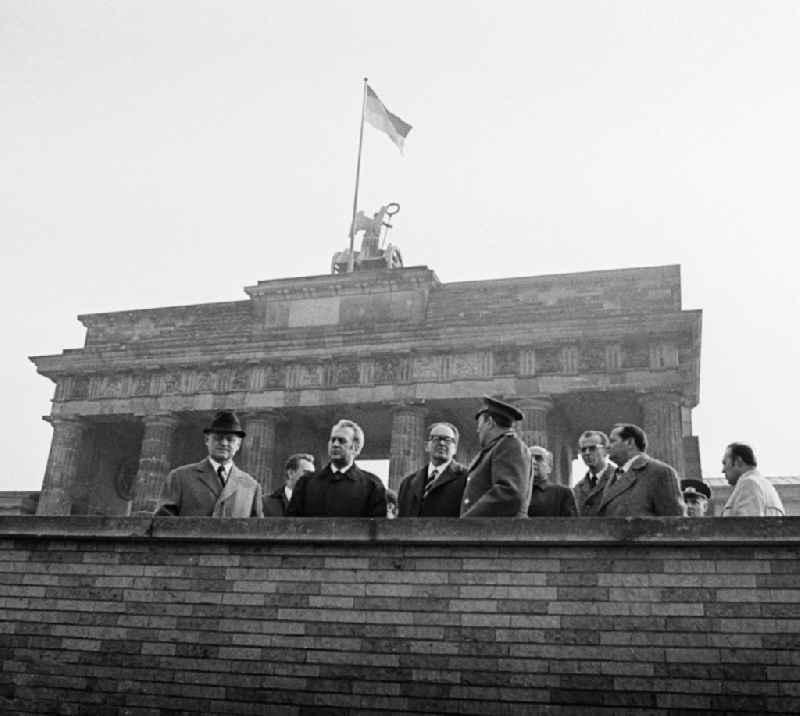 The commander of the Soviet sector of Berlin, general Artur Kunath, with politicians at the Brandenburg Gate in Berlin, the former capital of the GDR, German democratic republic