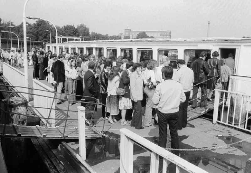 Guests and tourists in the steamboat landing stage of the 'white fleet' in the Treptower park in Berlin, the former capital of the GDR, German democratic republic
