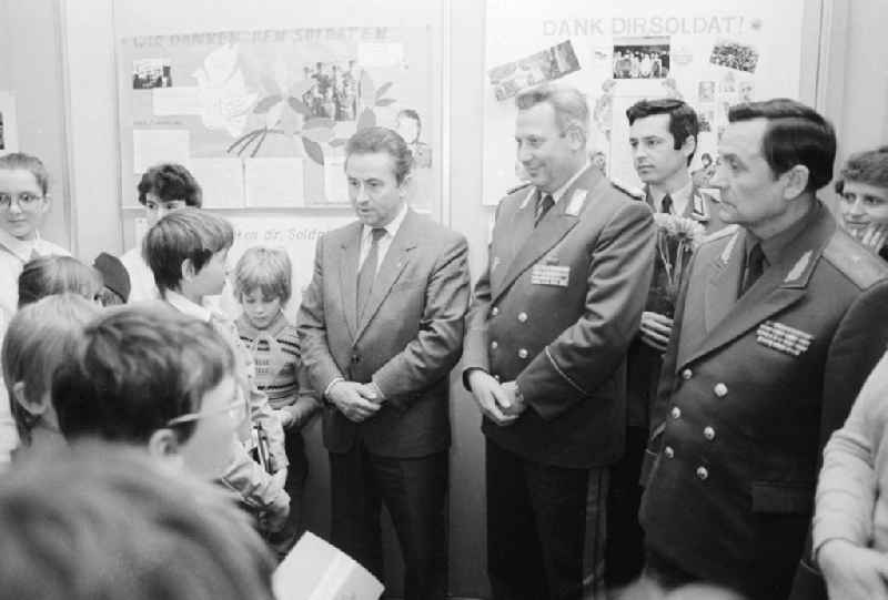 Young pioneers hand tinkered wall newspapers in the house of the 'German-Soviet friendship' (DSF) to generals of the national national army (NVA) and the red army in Berlin, the former capital of the GDR, German democratic republic