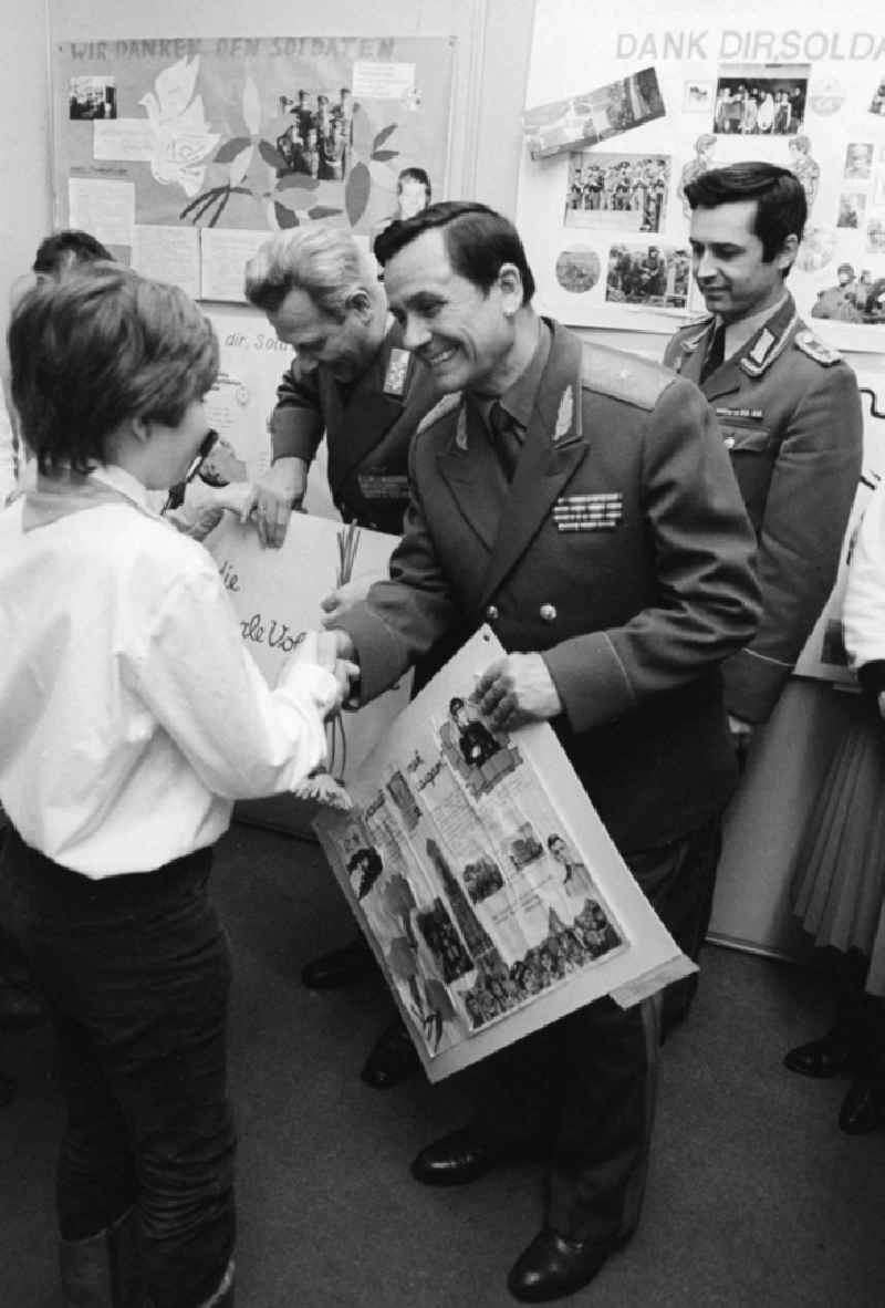 Young pioneers hand tinkered wall newspapers in the house of the 'German-Soviet friendship' (DSF) to generals of the national national army (NVA) and the red army in Berlin, the former capital of the GDR, German democratic republic