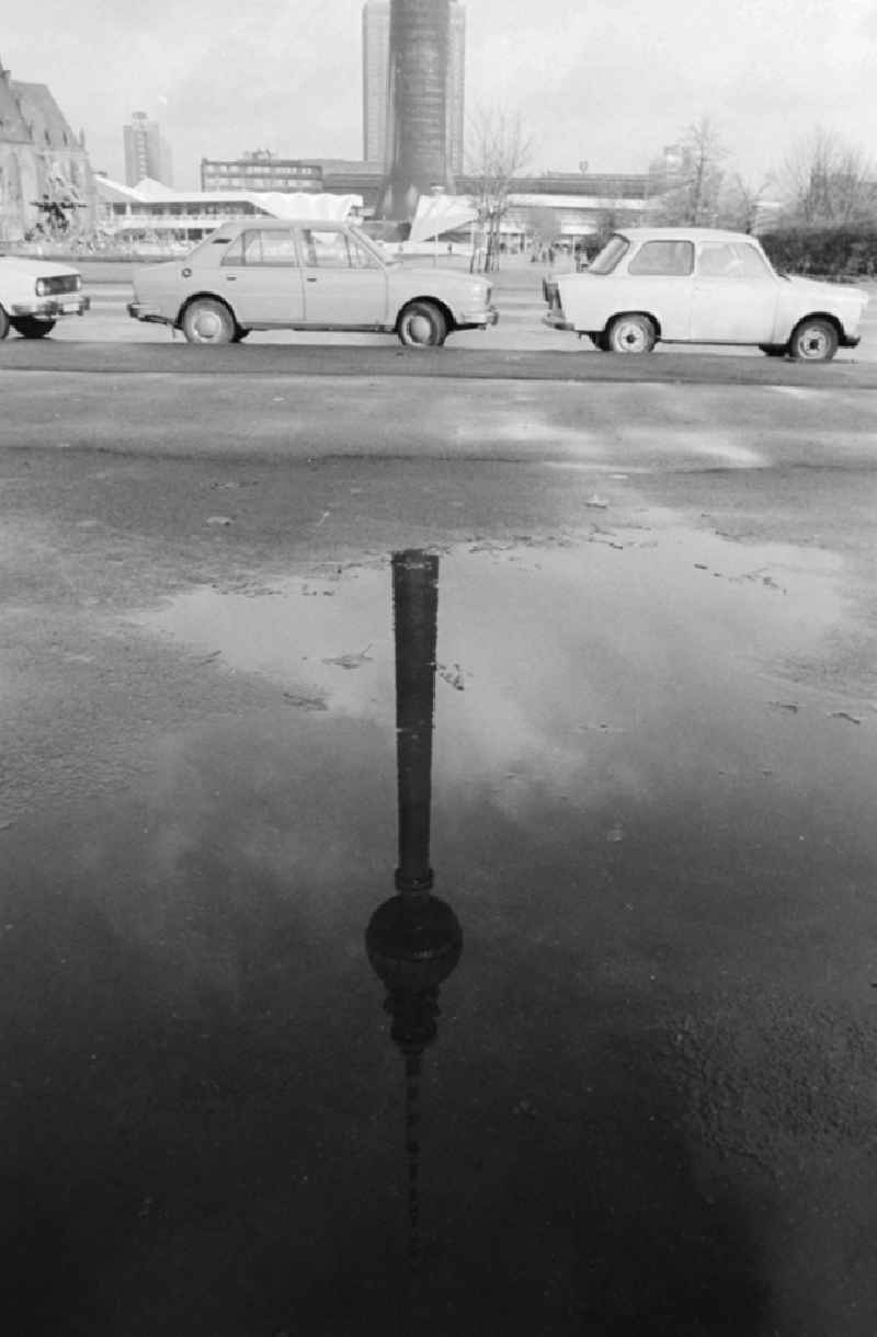 Reflexion of the Berlin television tower in a puddle in Berlin, the former capital of the GDR, German democratic republic