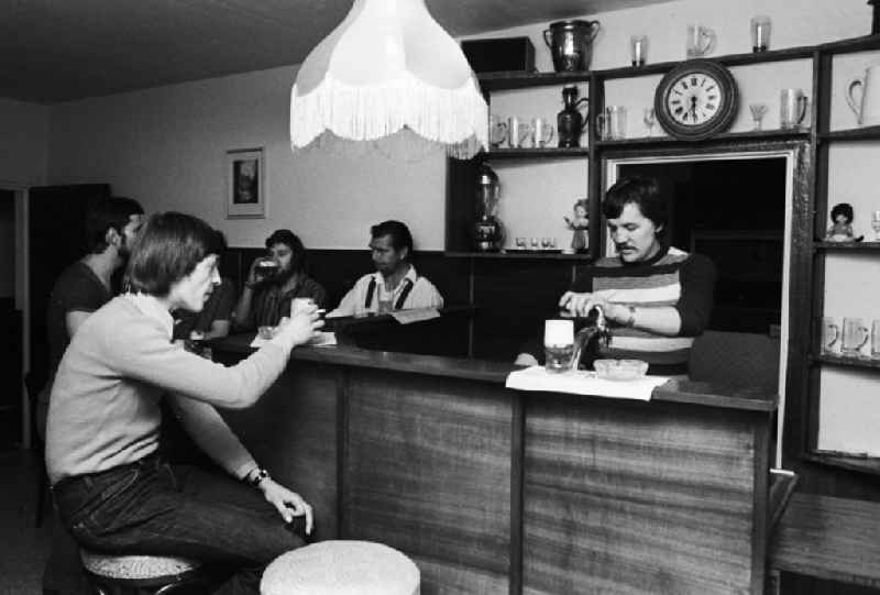 Youngsters sit comfortably with a beer at the bar at the youth tourist's hotel 'Egon Schultz' in the animal park in Berlin, the former capital of the GDR, German democratic republic. Today one says animal park ABACUS hotel
