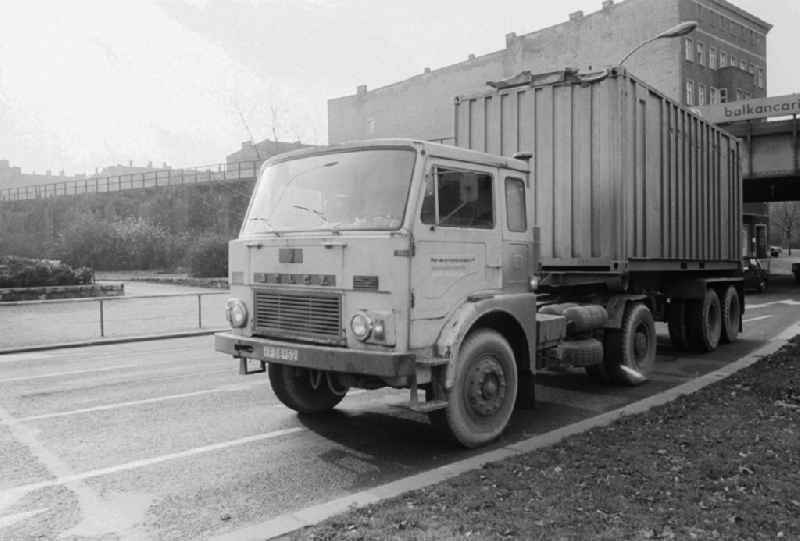 A truck of the type Jelcz 315 with an oversea container on the Frankfurt avenue in Berlin, the former capital of the GDR, German democratic republic