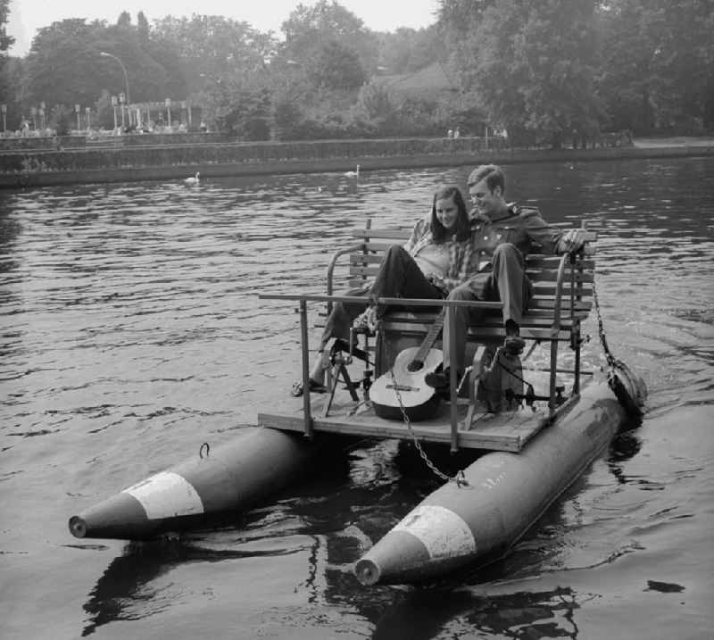 A pair in love on a pedal boat on the Spree in Berlin, the former capital of the GDR, German democratic republic
