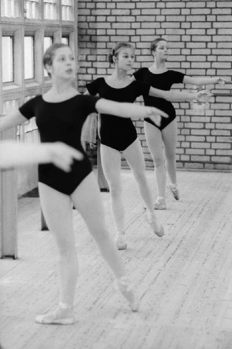 Ballet lessons in the state ballet school and school for acrobatics in Berlin, the former capital of the GDR, German democratic republic