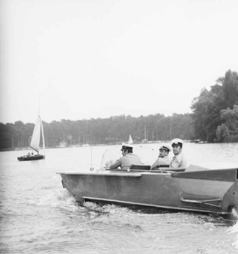 Policemen of the water protection police in a routine controlling journey in the Rummelsburger bay in Berlin, the former capital of the GDR, German democratic republic