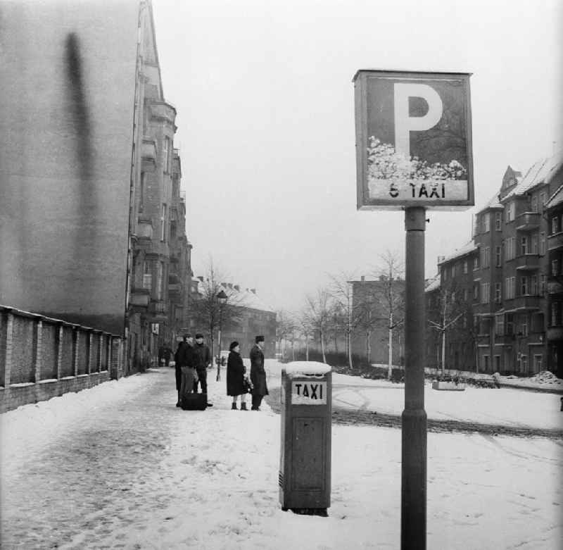 A queue in a taxi state on a taxi in wintry snow-covered Berlin, the former capital of the GDR, German democratic republic