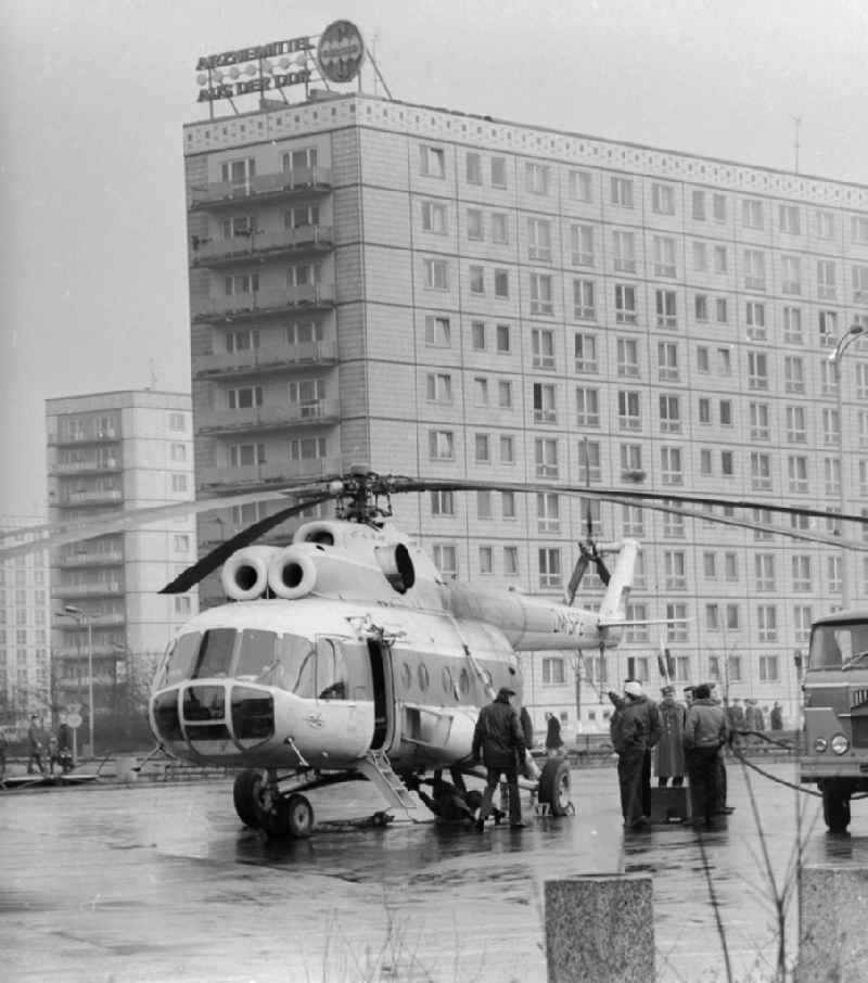 A transport, load helicopter Mil Mi-8 of the INTERFLUG, with the call sign DM-SPB is refuelled on a parking bay, in Berlin, the former capital of the GDR, German democratic republic