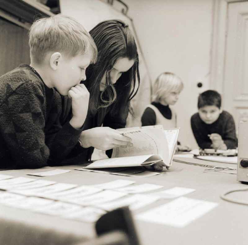 Children make together homework in Berlin, the former capital of the GDR, German democratic republic