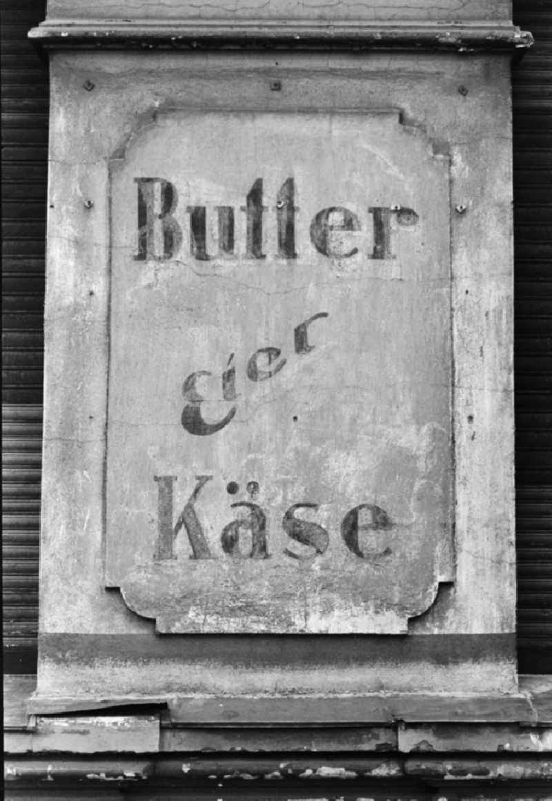 Promotional sign for butter, eggs and cheese of a consumption in Berlin, the former capital of the GDR, German democratic republic