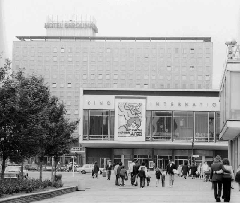The cinema INTERNATIONAL with the film poster for the Soviet film 'We wait for you boy' in the Karl Marx Allee in Berlin, the former capital of the GDR, German democratic republic. In the background the hotel BEROLINA