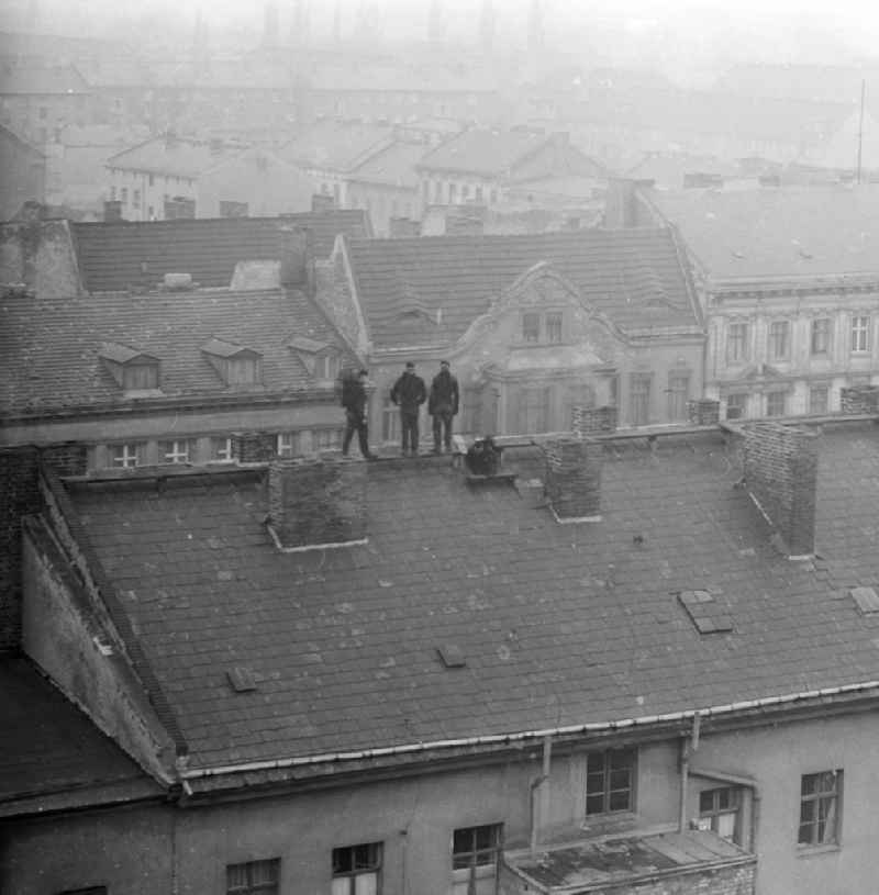 Chimney sweeper sweeping the roofs of Berlin, the former capital of the GDR, German Democratic Republic