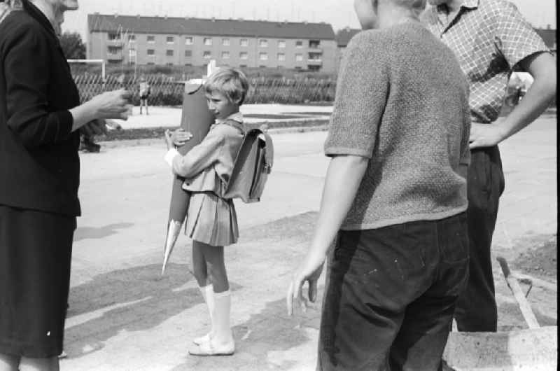 A girl proudly holds her sugar bag on the day of school enrolment in Berlin, the former capital of the GDR, German Democratic Republic