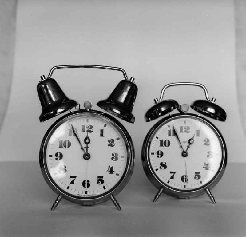 Symbolic picture - Two Alarm clocks ' Five before twelve' in Berlin, the former capital of the GDR, German Democratic Republic