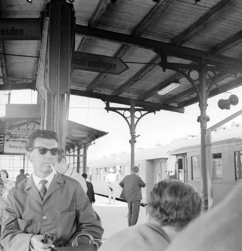 Travellers with luggage on arrival/departure at Schoeneweide station in Berlin, the former capital of the GDR, German Democratic Republic