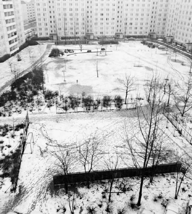 Snow-covered playground in a prefabricated building Residential area in Berlin, the former capital of the GDR, German Democratic Republic