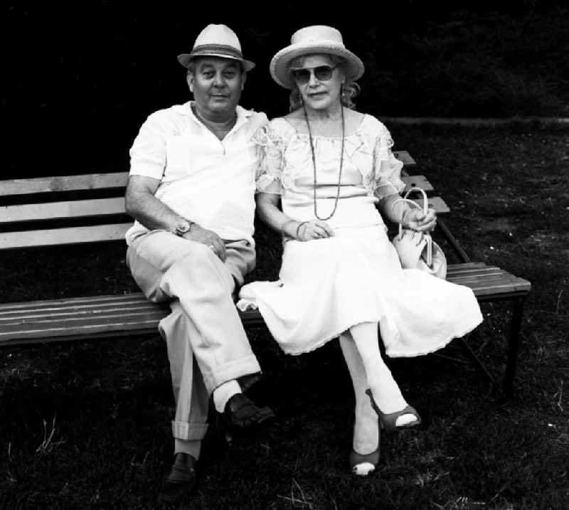 Pensioner couple on a park bench in Berlin, the former capital of the GDR, German Democratic Republic
