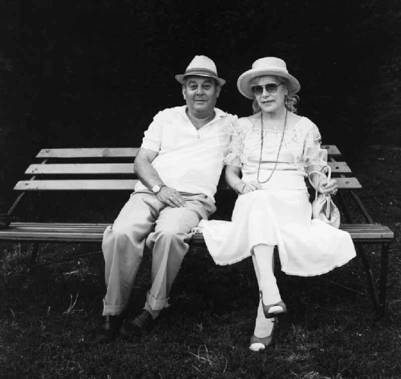 Pensioner couple on a park bench in Berlin, the former capital of the GDR, German Democratic Republic