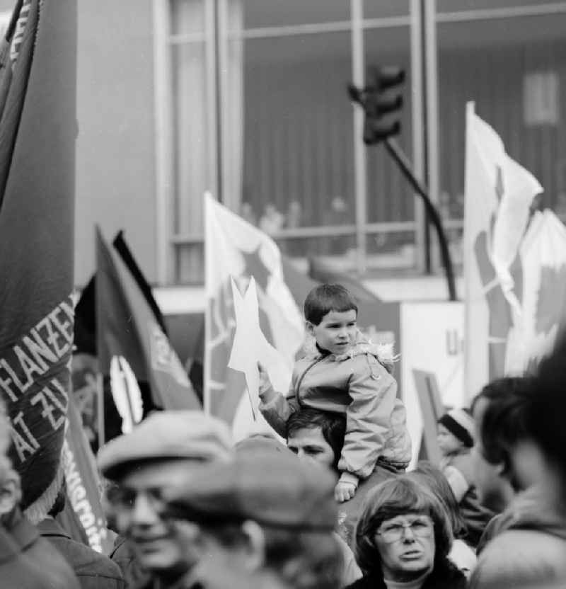Enthusiastic GDR citizens with children and family at the May 1 demonstration in Berlin, the former capital of the GDR, German Democratic Republic