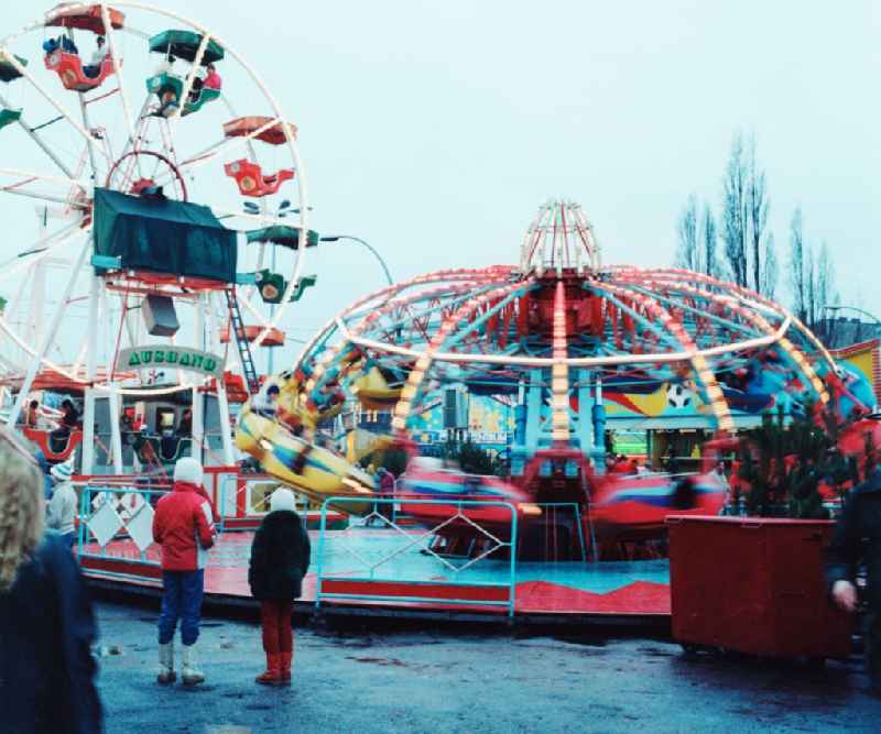 Rides and visitors at the Christmas Market in Berlin, the former capital of the GDR, German Democratic Republic