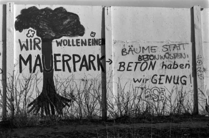 The slogan 'We want a Mauerpark. Trees instead of concrete deserts! Concrete we have enough!' stands on a former piece of the wall at the Friedrich-Ludwig-Jahn-Sportpark (also Jahnsportpark, Jahn-Sportpark, Jahnstadion or Cantianstadion) in Berlin - Prenzlauer Berg, the former capital of the GDR, German Democratic Republic