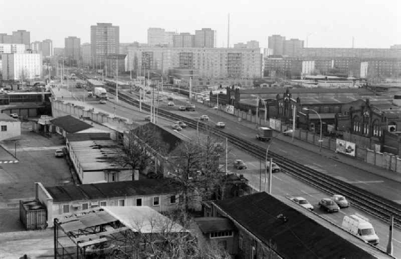 Leninallee (today Landsberger Allee ) with the production facilities and production equipment of the municipal slaughterhouse (r.) and view of the prefabricated buildings in Berlin - Friedrichshain and Lichtenberg, the former capital of the GDR, German Democratic Republic