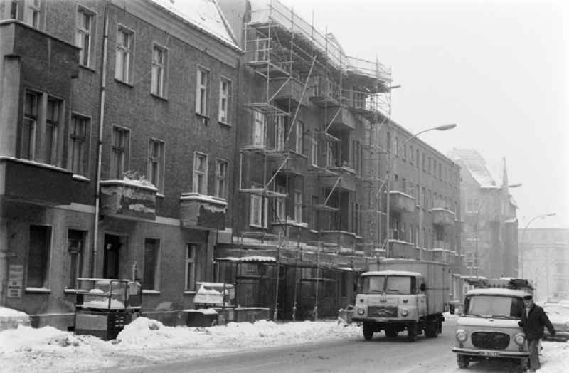 Winter and snow in the street Siemensstrasse in the district of Treptow-Koepenick in Berlin, the former capital of the GDR, German Democratic Republic. Truck Robur LO 3000 and van Barkas B 100