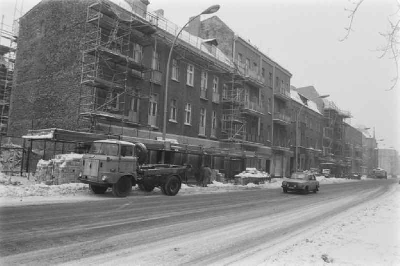 Winter and snow in the street Siemensstrasse in the district of Treptow-Koepenick in Berlin, the former capital of the GDR, German Democratic Republic. Truck W5