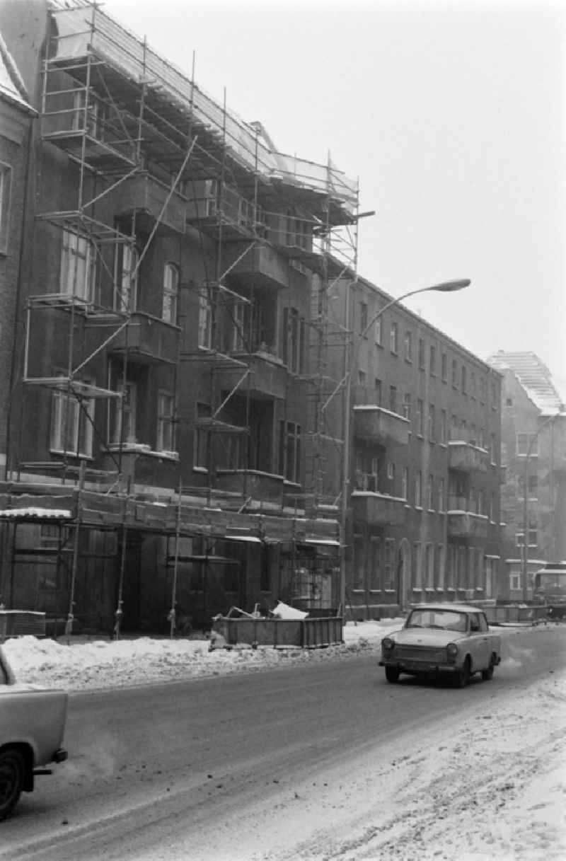 Winter and snow in the street Siemensstrasse in the district of Treptow-Koepenick in Berlin, the former capital of the GDR, German Democratic Republic. Car Trabant 6
