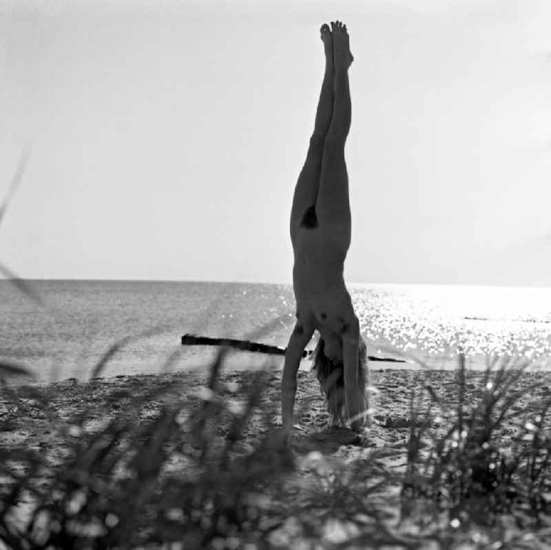 Nude of a young woman on lake Langer See in Berlin, the former capital of the GDR, German Democratic Republic