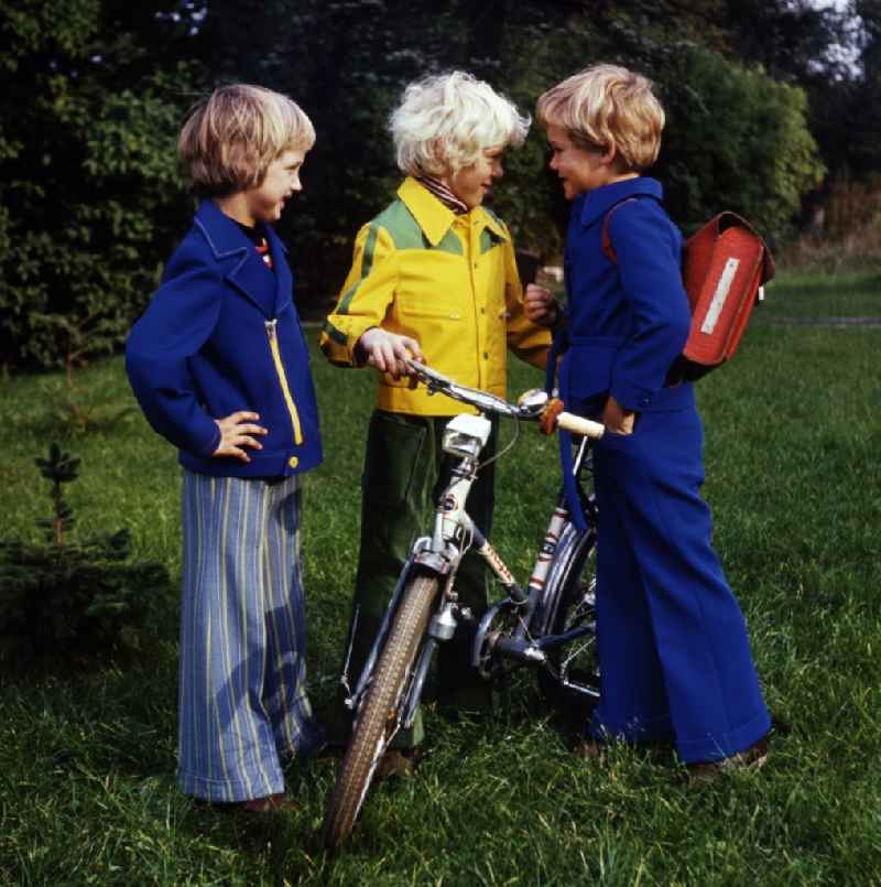 Fun and games for children and teenagers in colorful school clothes in Berlin, the former capital of the GDR, German Democratic Republic