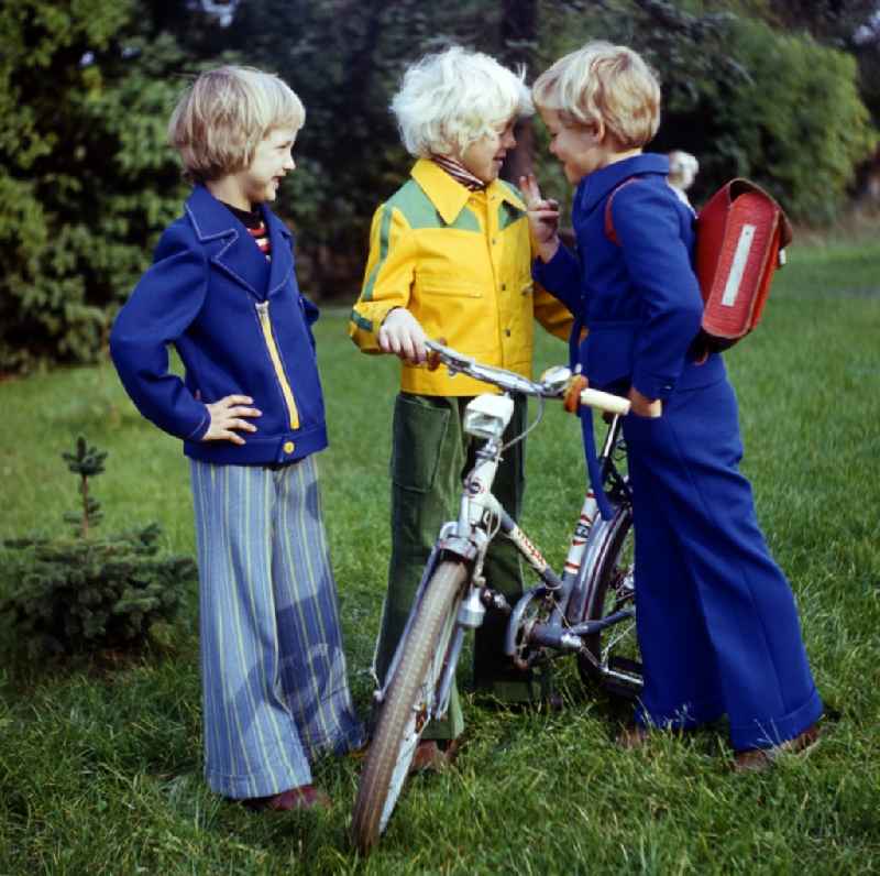 Fun and games for children and teenagers in colorful school clothes in Berlin, the former capital of the GDR, German Democratic Republic